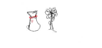 Een klein buideltje met een rood koordje en een bloem